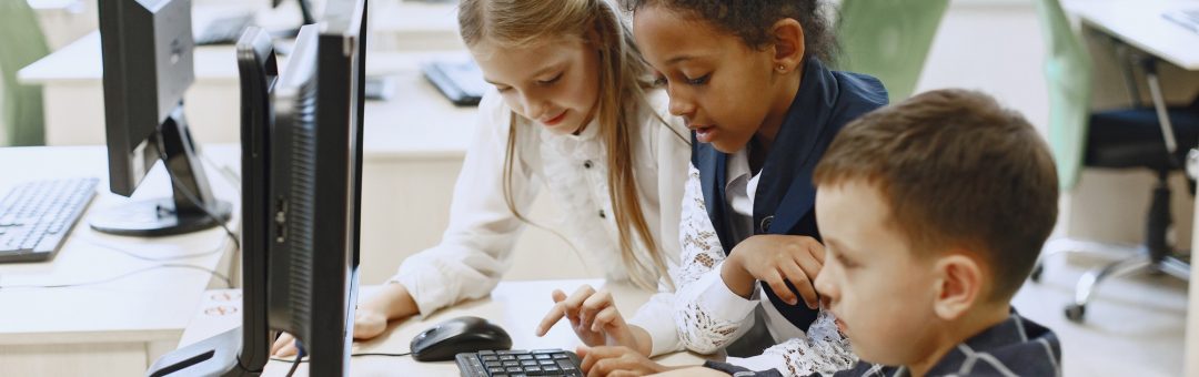guy-girl-are-sitting-table-african-girl-computer-science-class-kids-playing-computer-games